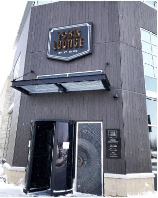 Lounge’s facade, which is a gray building with the name 1933 Lounge placed on top of the entrance